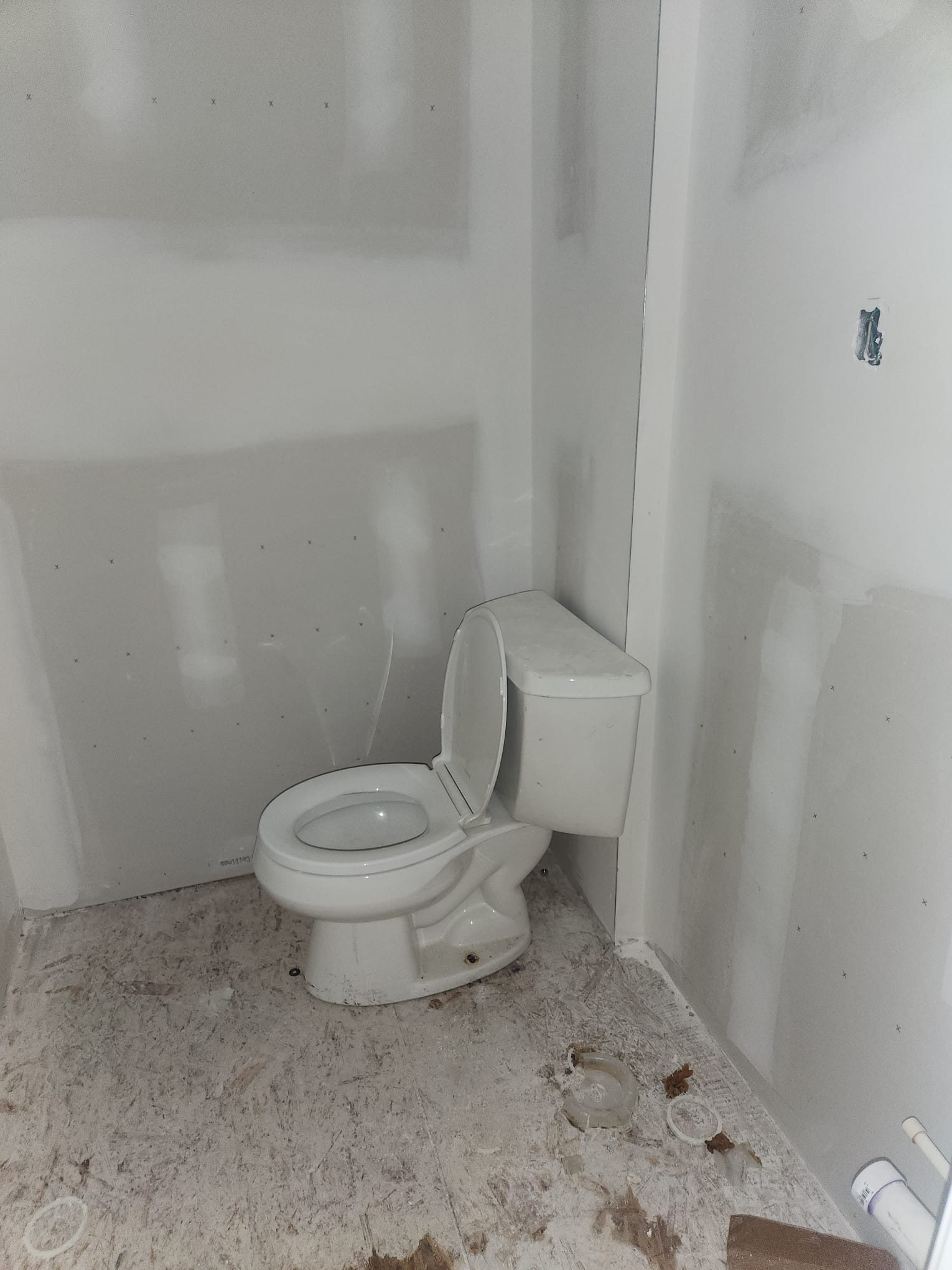 Bathroom remodel with toilet installation and fresh drywall