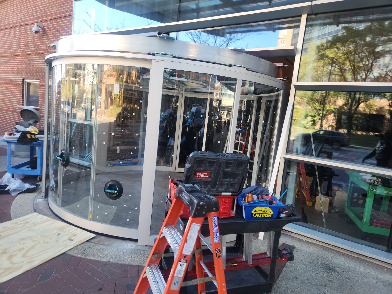 Glass revolving door installation at commercial property