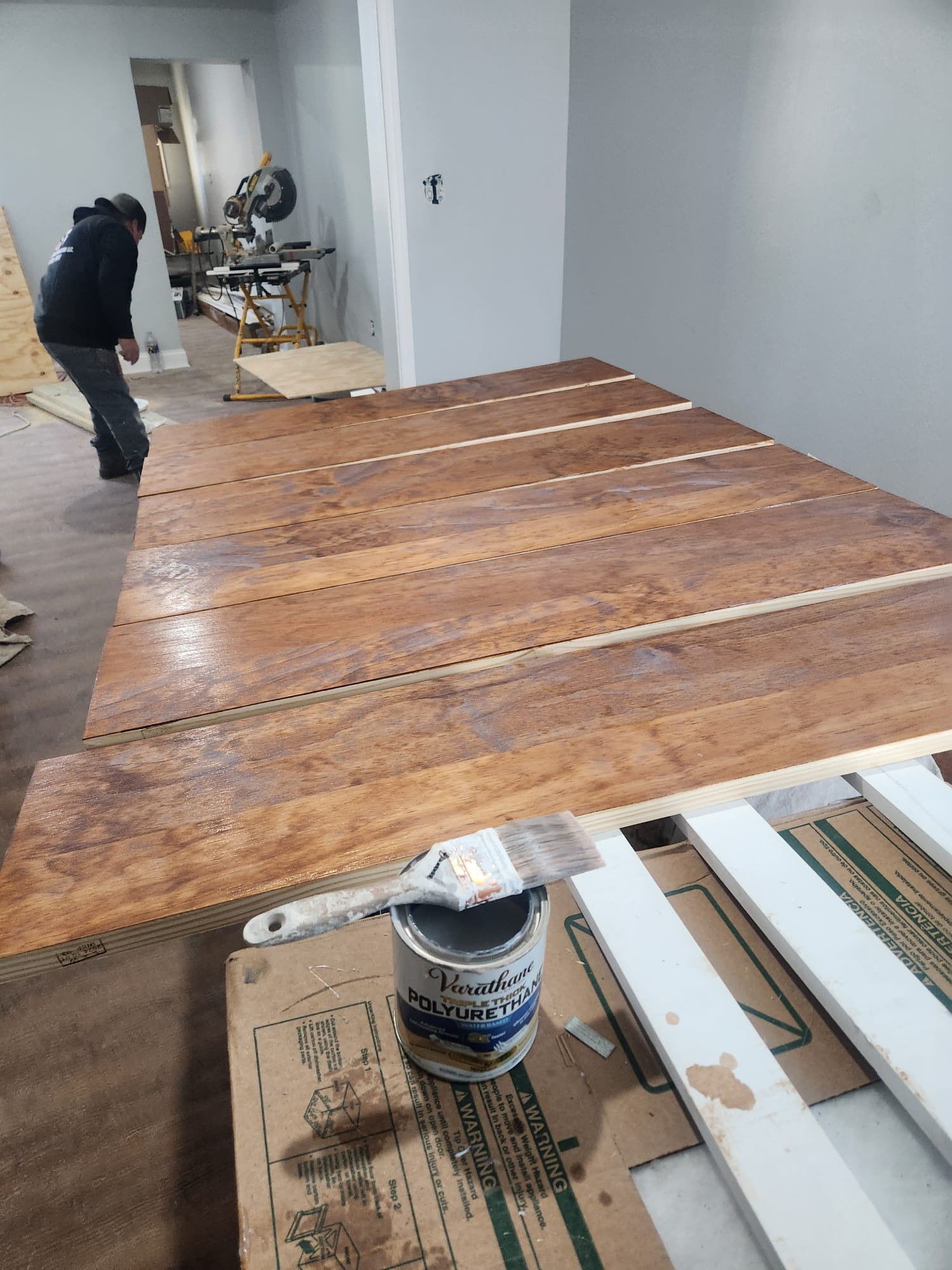 Hardwood floor installation with polyurethane finish