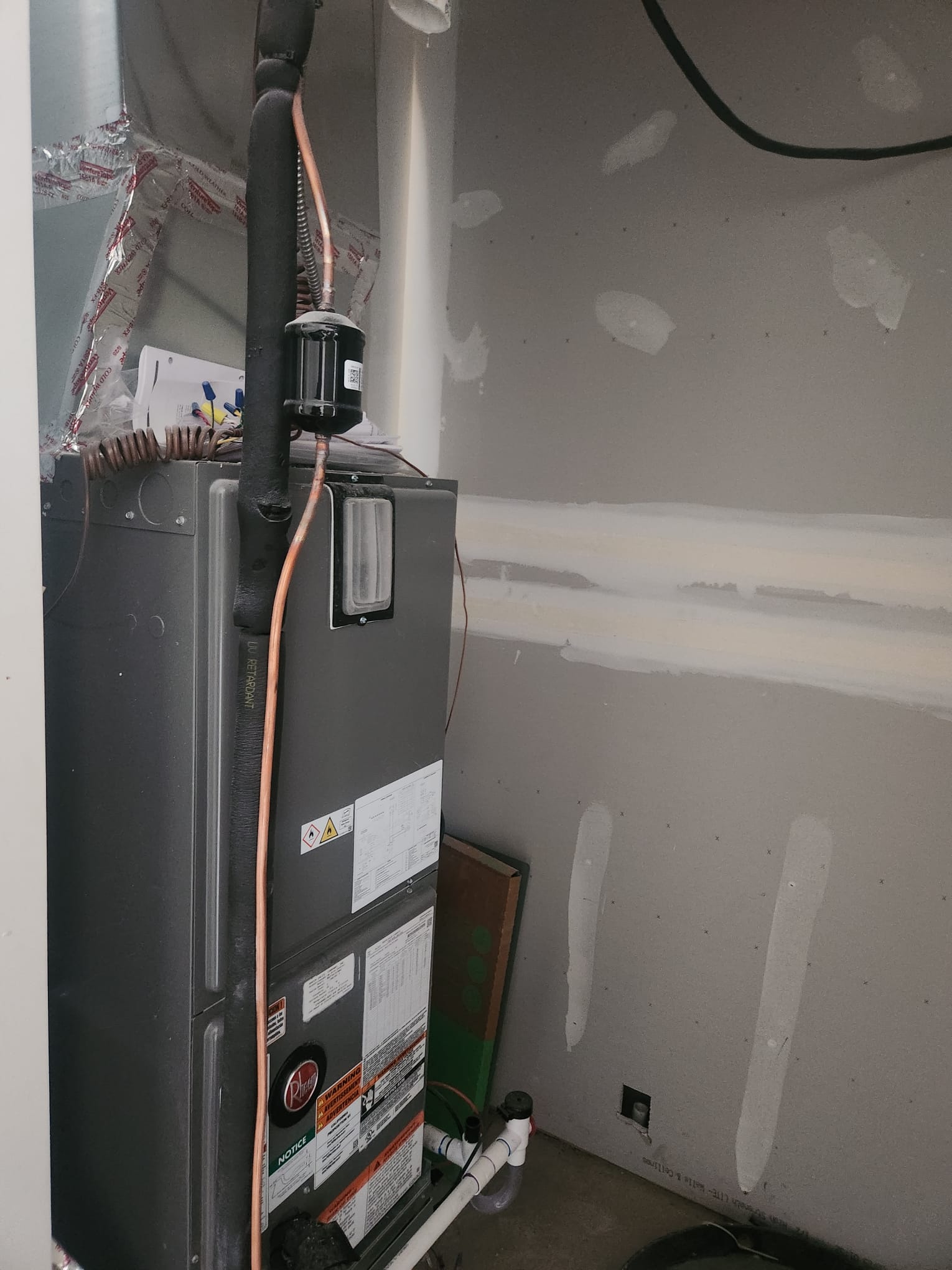 HVAC air handler unit installed in utility closet