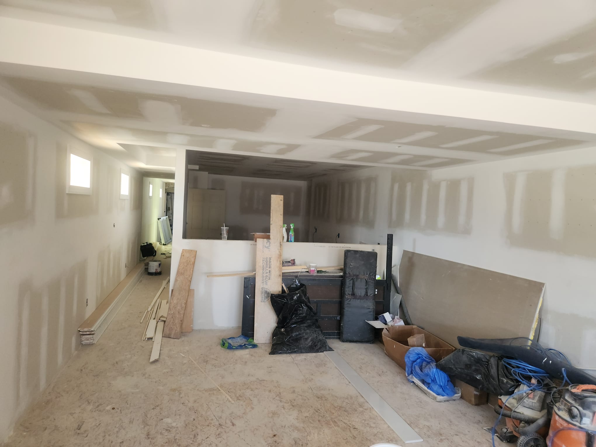 Open concept home remodel with drywall and kitchen pass-through